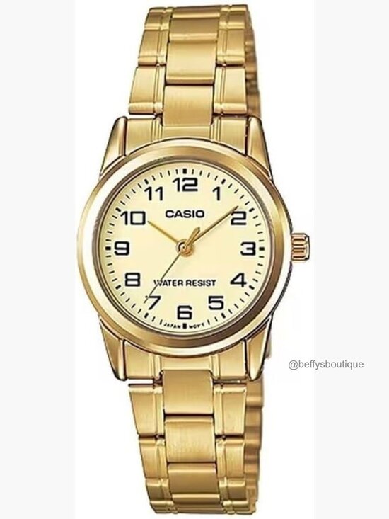 Vintage Gold Tone Watch with Quartz Movement and Mineral Crystal